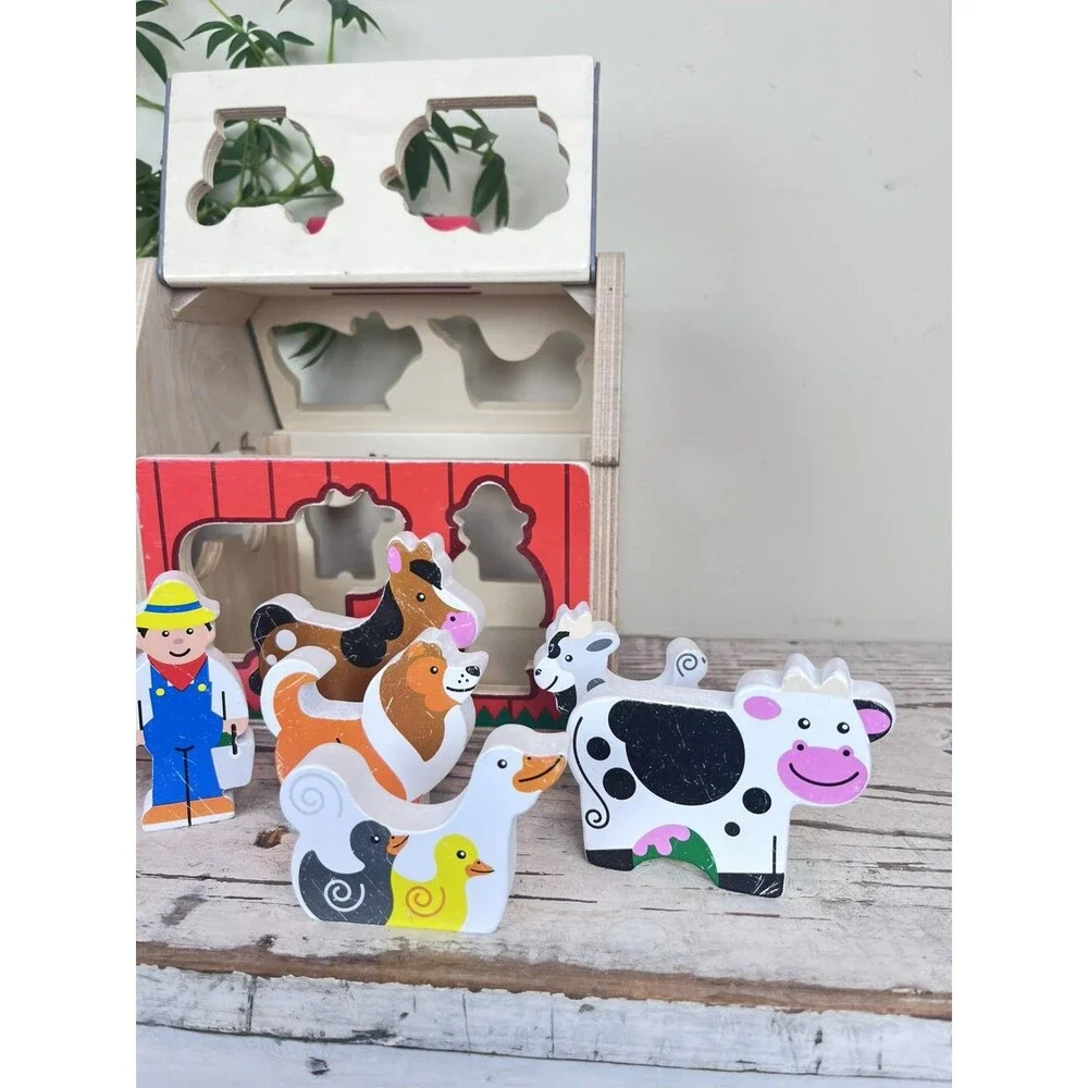 Melissa & Doug Wooden Take-Along Shape Sorting Barn with Flip-Up Roof 9 Figures